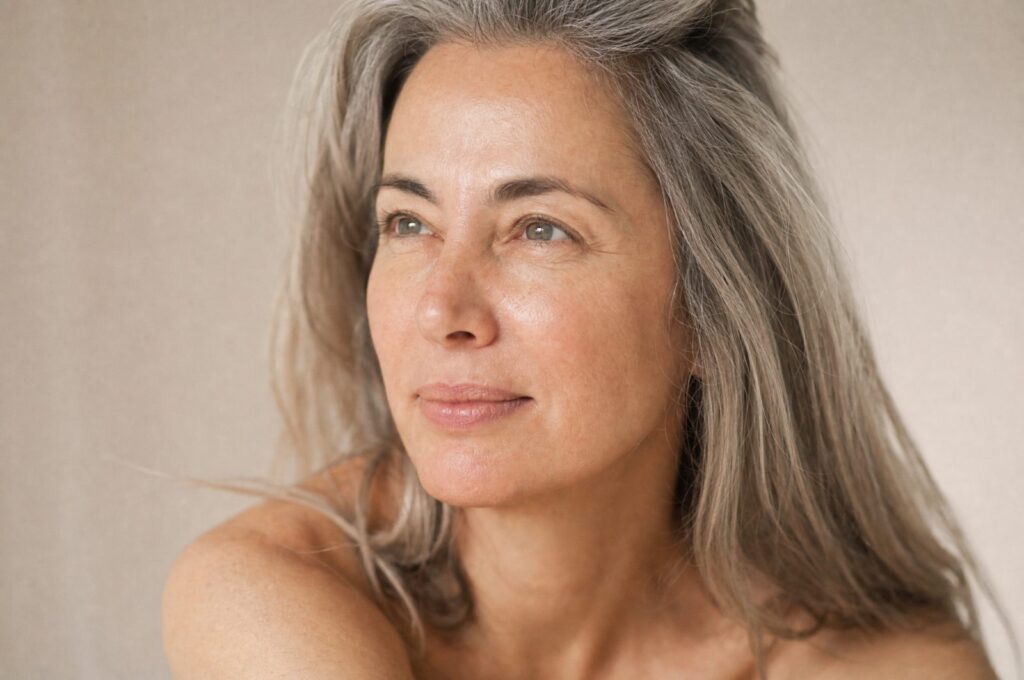 Mature woman with healthy, radiant skin in natural light